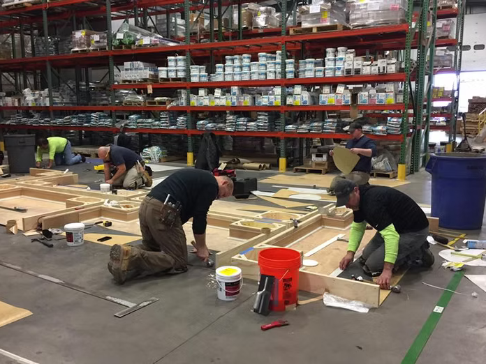 Flooring contractors building a project in a CT warehouse